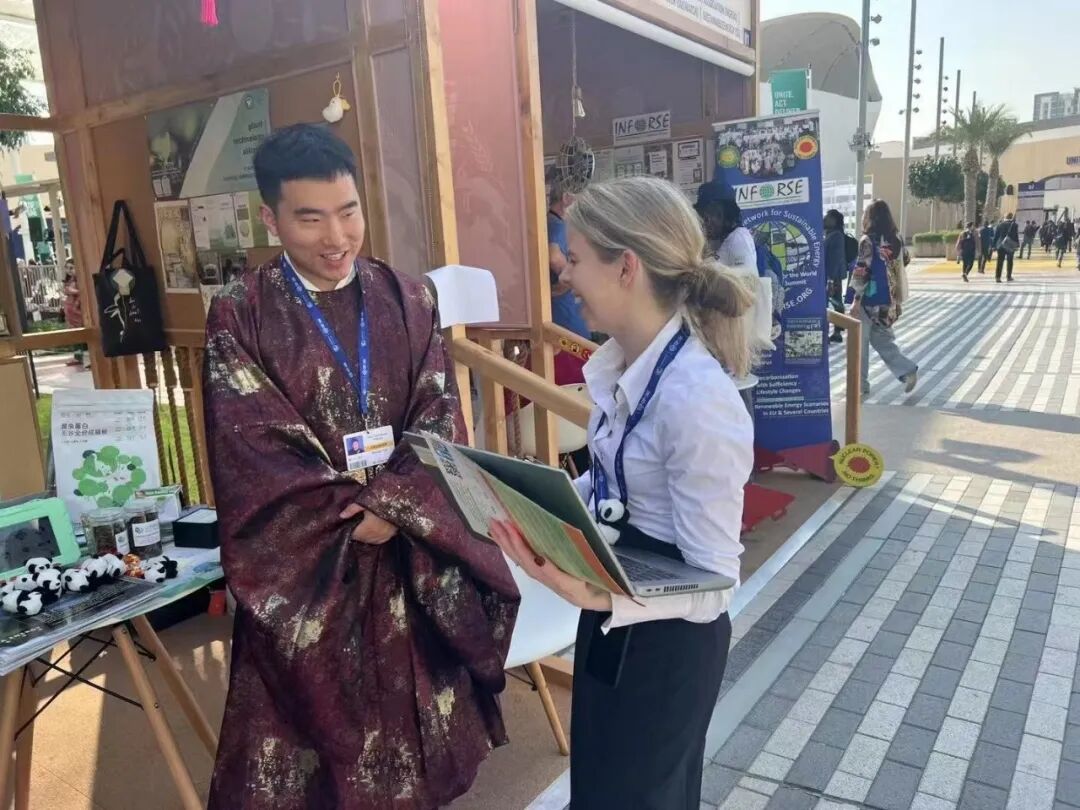 pta speaking with visitors at COP28 in Dubai
